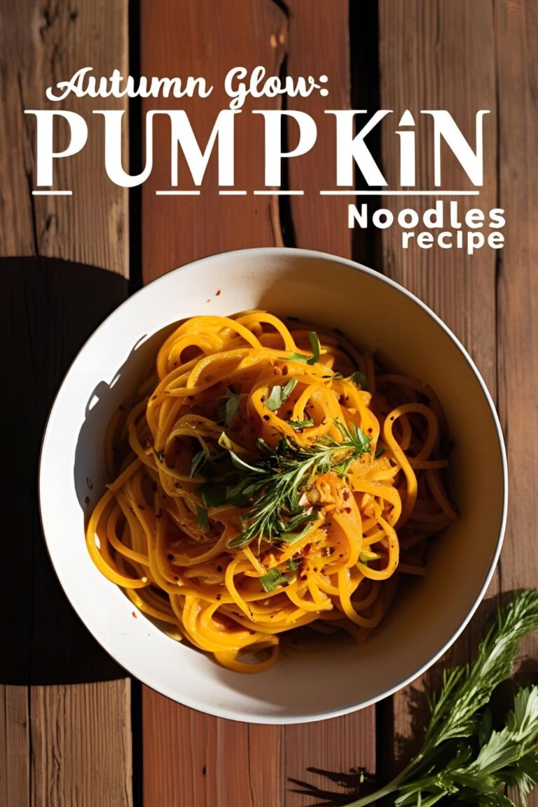 Bowl of cinnamon-spiced pumpkin noodles garnished with sage.