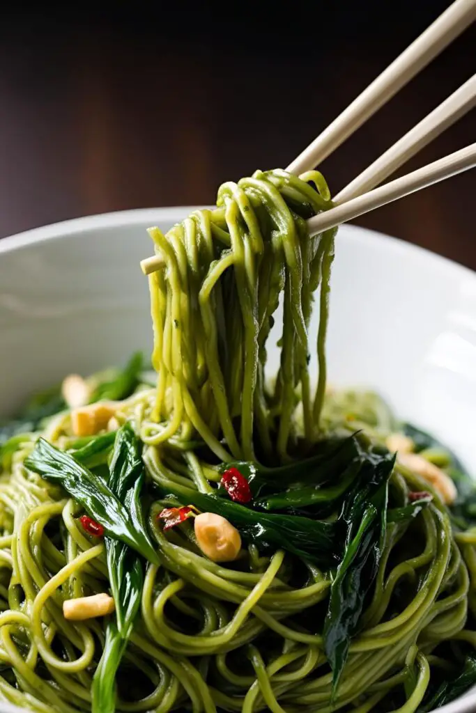  Flat lay of green tea noodles ingredients on a wooden surface.