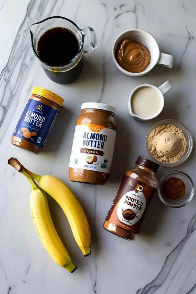  "Close-up of a frothy coffee smoothie topped with cocoa powder."
