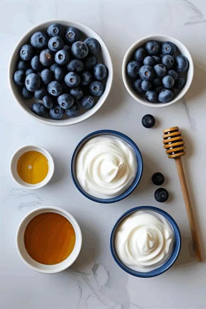 Close-up of frozen yogurt-covered blueberries on parchment paper